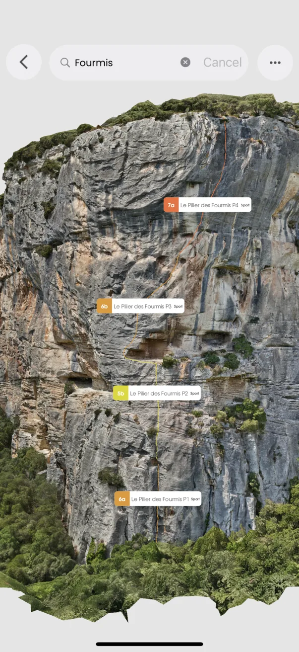 Vertical wall with route overlays and labeled pitches such as Le Pilier des Fourmis.